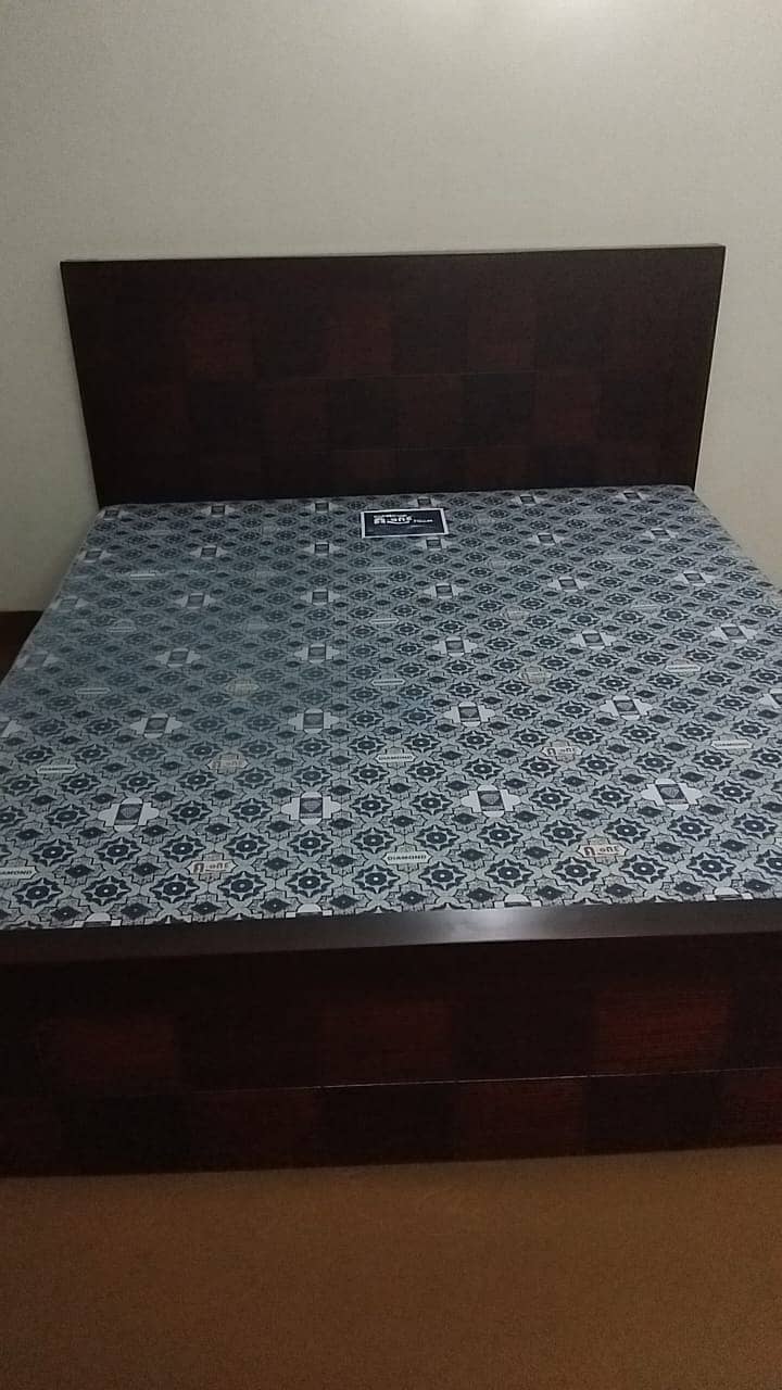 dark brown wooden bed only 1