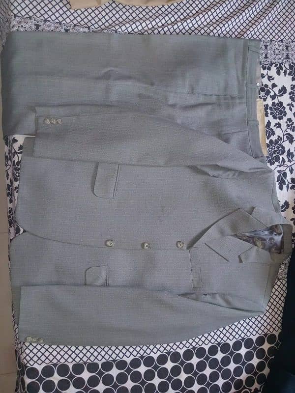 Grey and Greenish Suit, Black Waist Coat and Blue Coat in Rs 10000 2