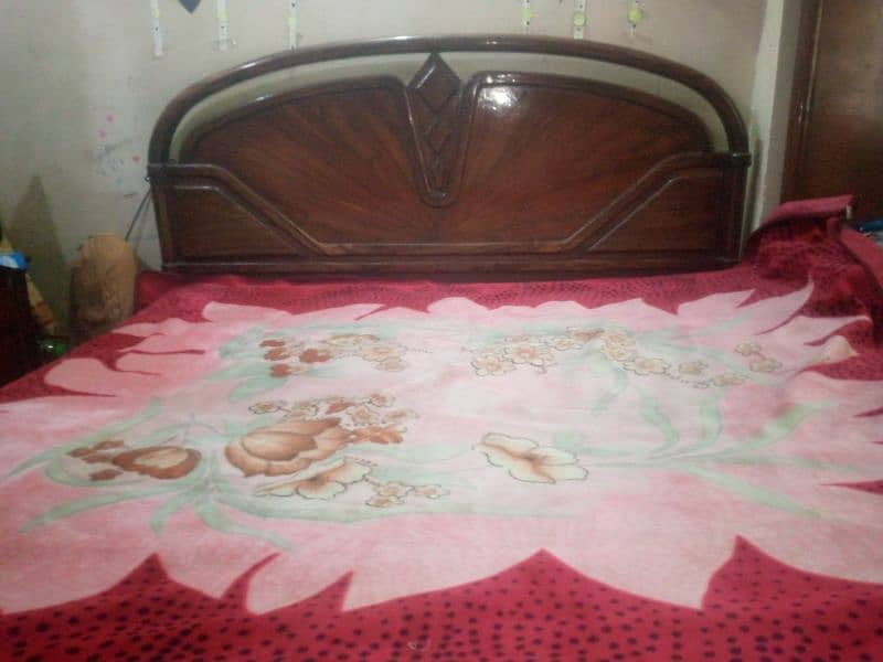 Double bed with new mattress and wooden sheet 0