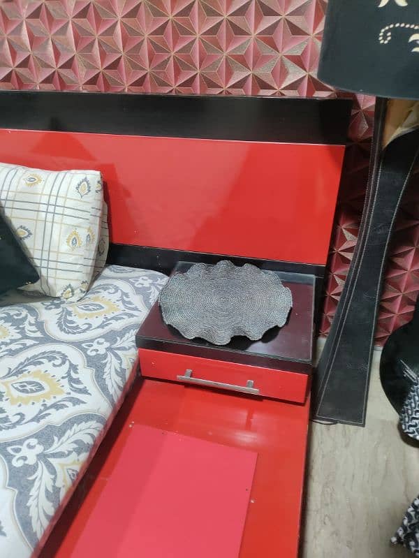 Wooden black an red color bed 1