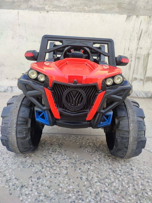 4 by 4 kids jeep with charger and remote in red and black combo 0