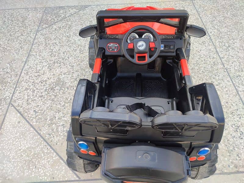 4 by 4 kids jeep with charger and remote in red and black combo 1