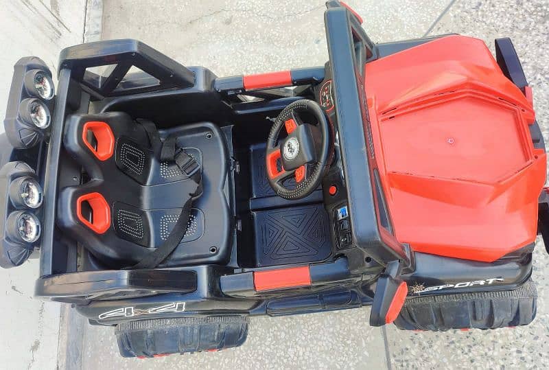 4 by 4 kids jeep with charger and remote in red and black combo 2