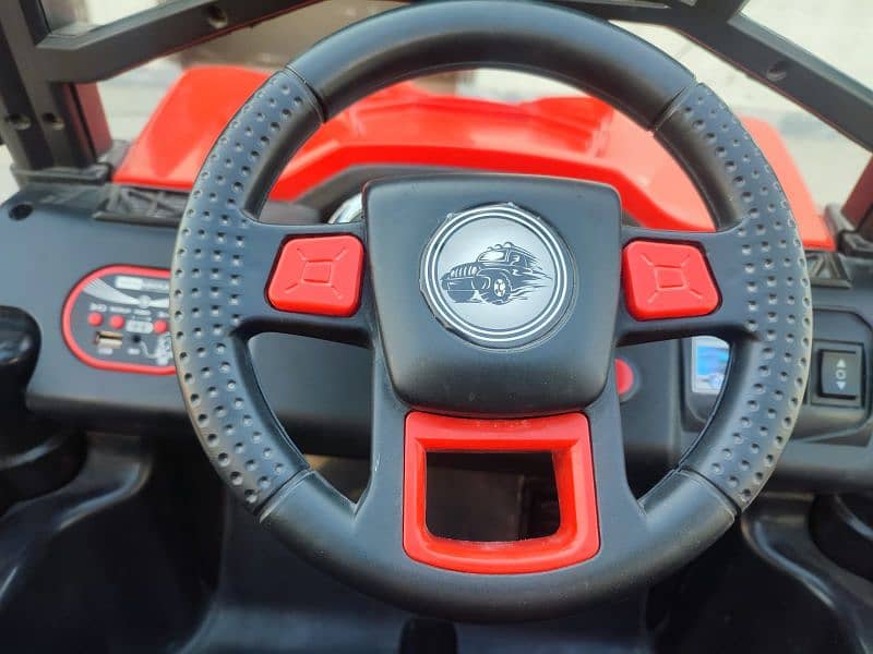 4 by 4 kids jeep with charger and remote in red and black combo 3