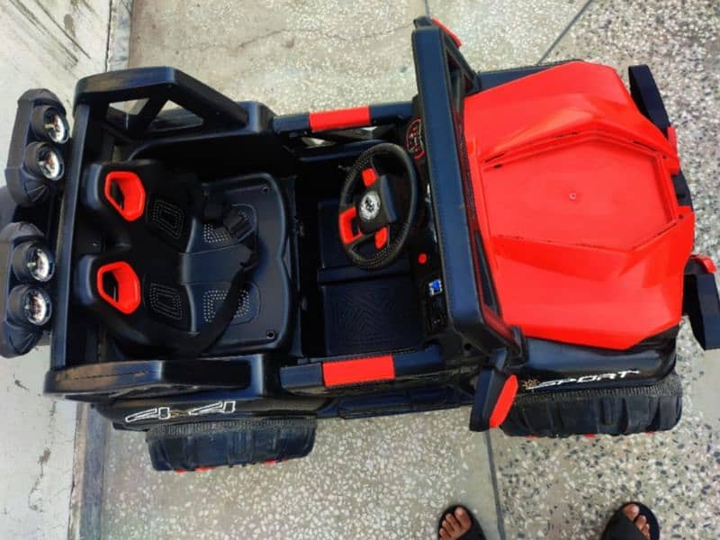 4 by 4 kids jeep with charger and remote in red and black combo 8