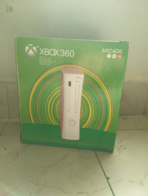 Xbox 360 arcade with 320 gb storage and 2 controller 0