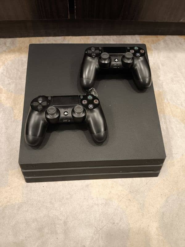 PS 4 PRO 1 TB WITH CONTROLLERS AND GAMES 0