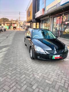 Mitsubishi lancer new condition better wagonr Corolla city civic