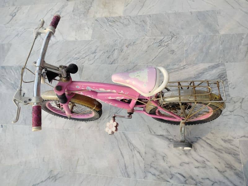 old kids pink bicycle 0