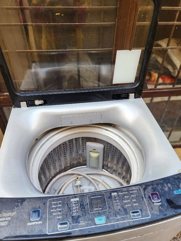 Haier Automatic washing machine/7 kg top load/slightly used 2