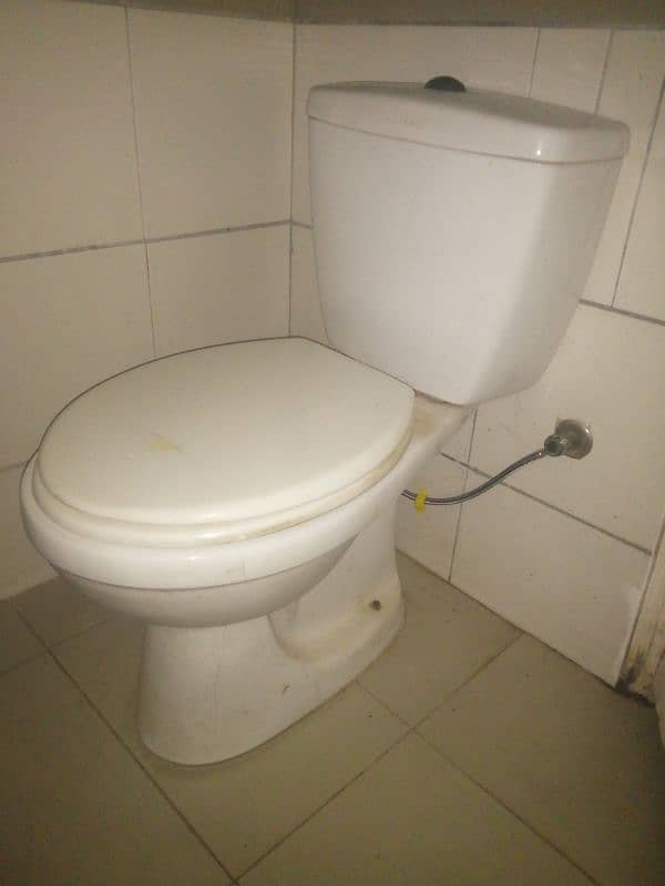 Almost new toilet with flash tank 0