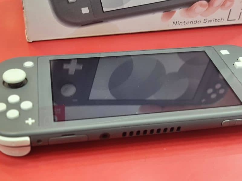 Nintendo Switch Lite (Grey Mint Condition] 6