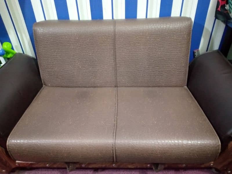 two seater sofa cum bed in leather with inner draws 0