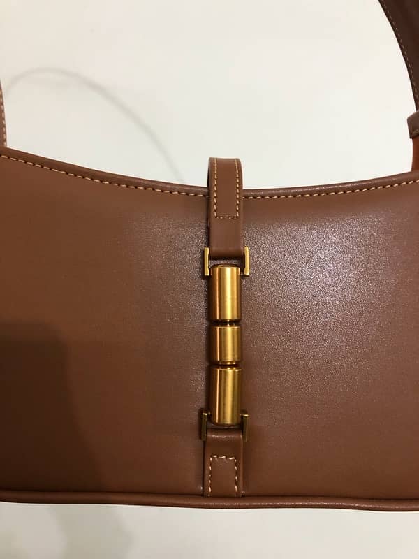 Brown leather bag from “Manchali” 1