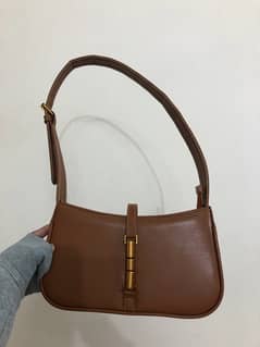 Brown leather bag from “Manchali”