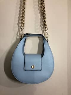 “Scoop” crossbody bag