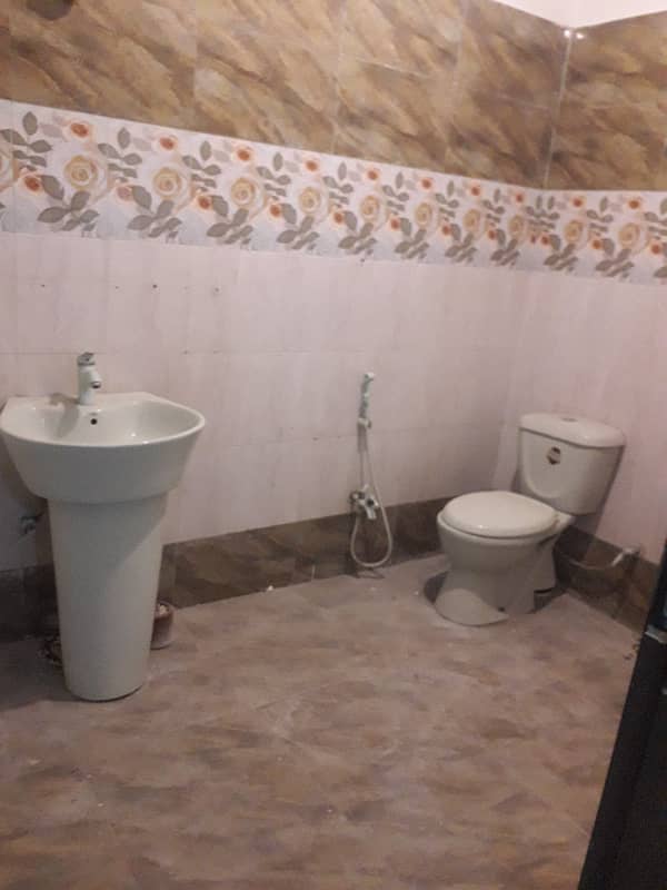 tiled flooring three bed dd portion for rent in johar 0