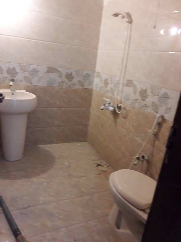 tiled flooring three bed dd portion for rent in johar 5