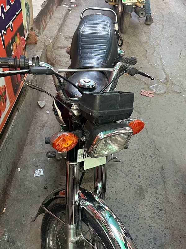 Honda 125 good condition first owner triple number 2