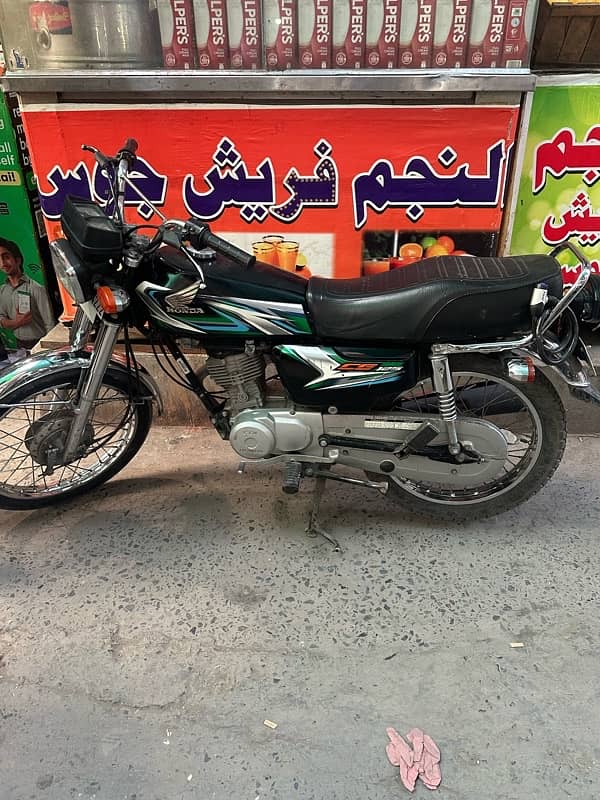 Honda 125 good condition first owner triple number 3