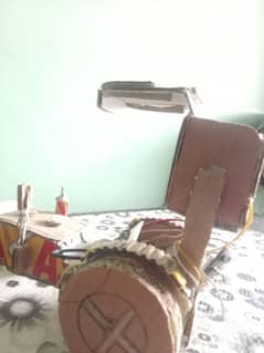 handmade cardboard tractor with speakers and with neon lights