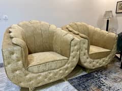 A pair of sofas crown style full size golden colour