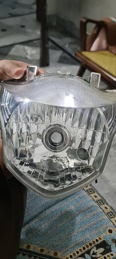 Suzuki GR150 genuine headlight crystal clear glass