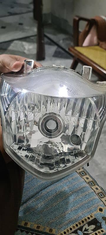 Suzuki GR150 genuine headlight crystal clear glass 0