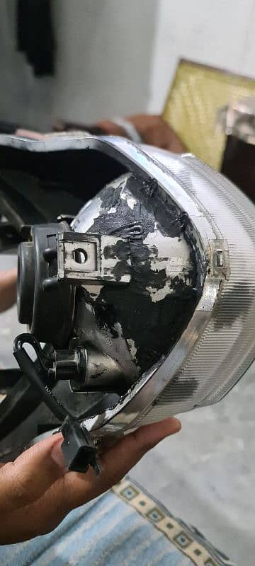 Suzuki GR150 genuine headlight crystal clear glass 2