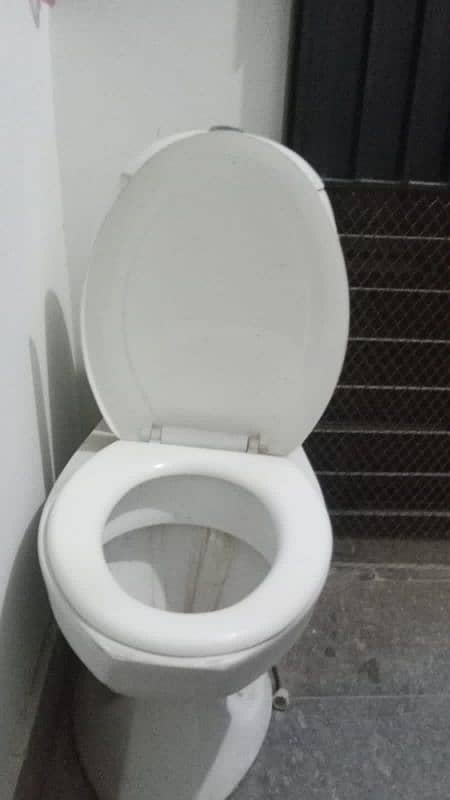 slightly used commode for sell white colour 2