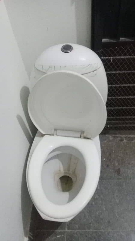 slightly used commode for sell white colour 3