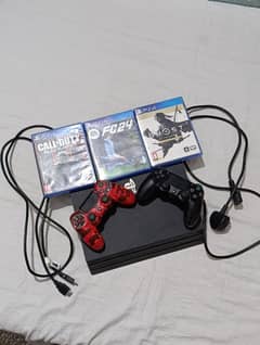 PS4 pro with 2 controllers and 4 games