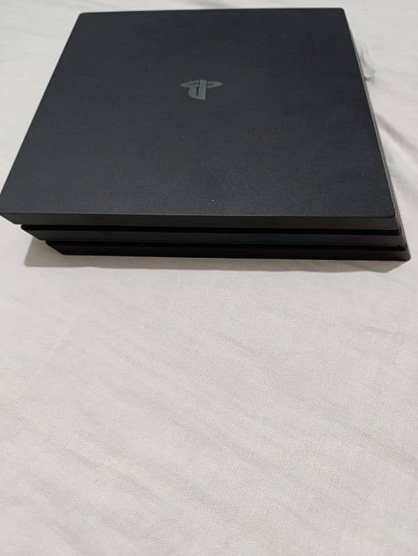 PS4 pro with 2 controllers and 4 games 2