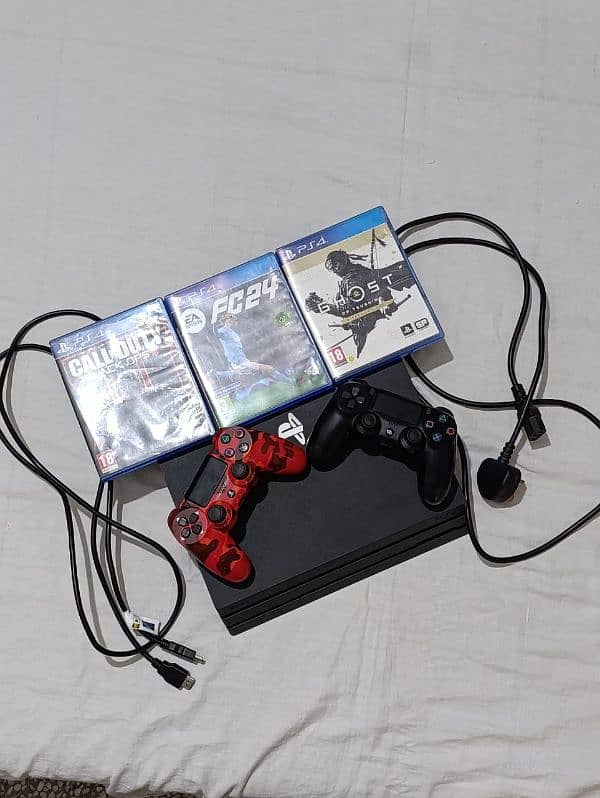 PS4 pro with 2 controllers and 4 games 16