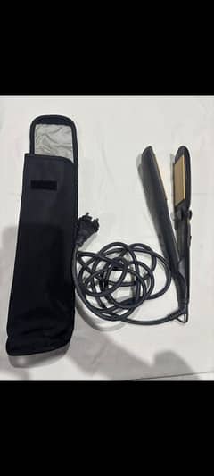 Braun professional hair straightener with packing.