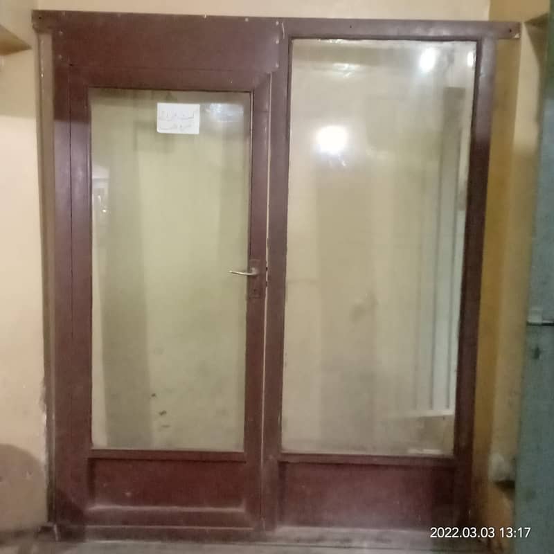 Glass door with iron frame for shop clinic saloon or office. 0