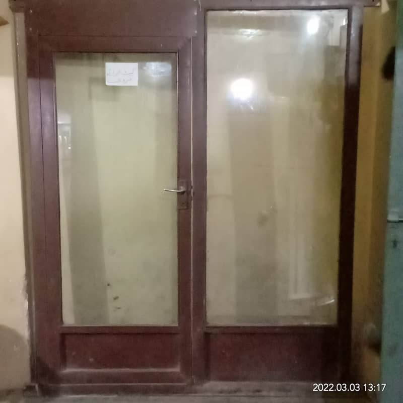 Glass door with iron frame for shop clinic saloon or office. 1