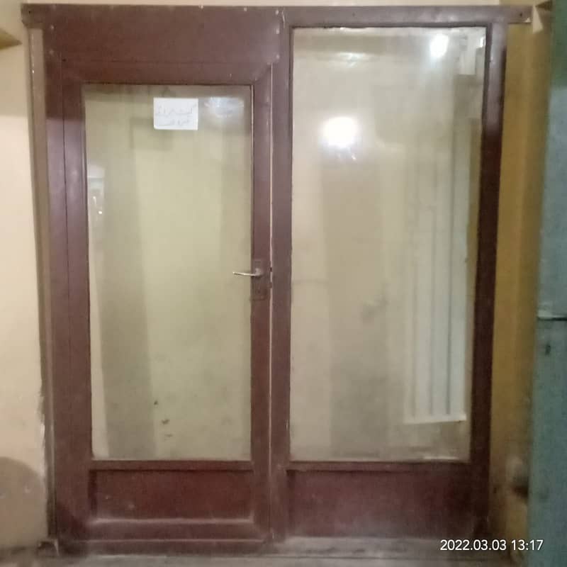 Glass door with iron frame for shop clinic saloon or office. 4