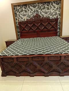 carved wood bed