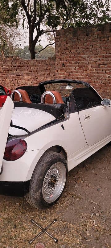 Daihatsu Copen 2 door convertible. 4