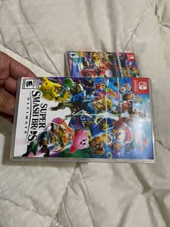 super smash bros ultimate and Mario cart deluxe Nintendo game cards