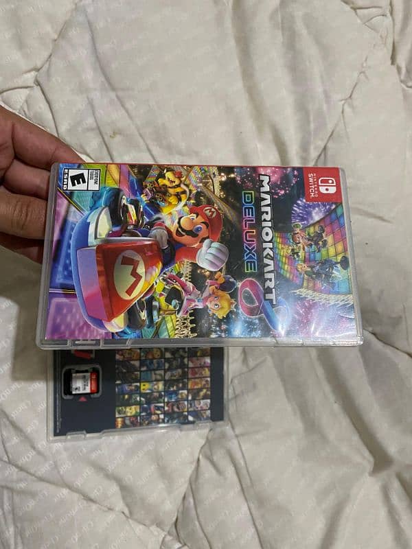 super smash bros ultimate and Mario cart deluxe Nintendo game cards 1