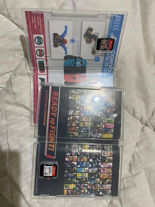 super smash bros ultimate and Mario cart deluxe Nintendo game cards 2