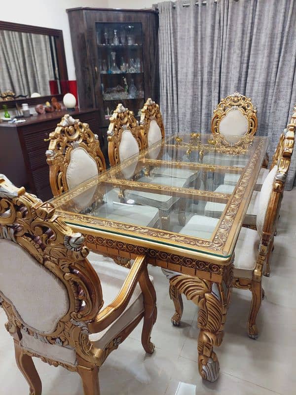 golden dining table and 8 chairs 0