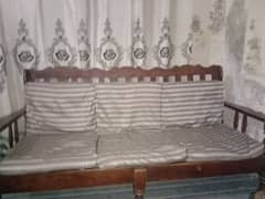 This is 5 seater sofa set with a table