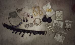 earrings, necklaces, and a ring for sale at low price