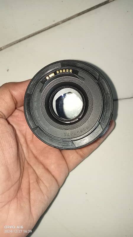 Canon 50mm F1.8 with glass 1