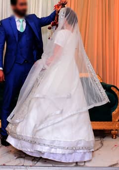 Bridal Perfection: White Frock Maxi with Lehenga for a Reception.