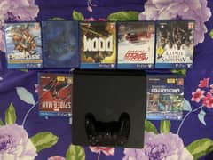 Playstation 4 Slim, 2 Controllers and 7 Games