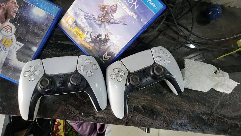 ps5 with two controllers good condition  ( used ) 1